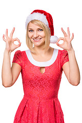 Image showing Woman in santa hat making ok