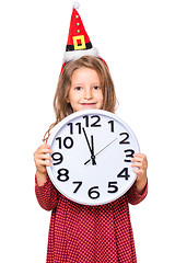 Image showing Girl in santa hat with clock