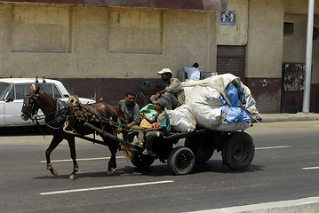 Image showing Men transport garbage