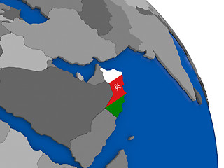 Image showing Oman and its flag on globe