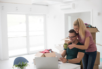 Image showing Young couple moving in a new home