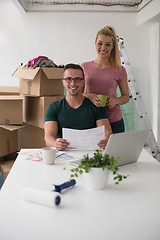 Image showing Young couple moving in a new home