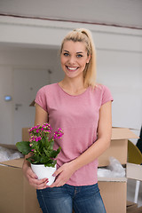Image showing girl moving in the new apartment