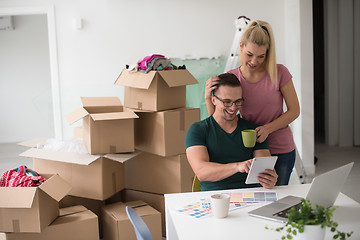 Image showing Young couple moving in a new home