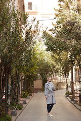 Image showing Young blond woman with sunglases on the street