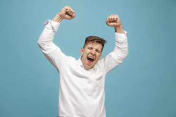 Image showing Winning success man happy ecstatic celebrating being a winner. Dynamic energetic image of male model