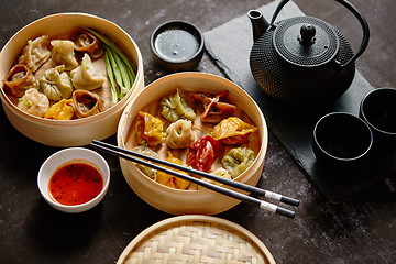 Image showing Composition of chinese food. Mixed kinds of dumplings from woode