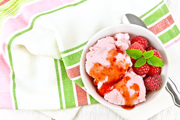 Image showing Ice cream crimson with syrup on board top