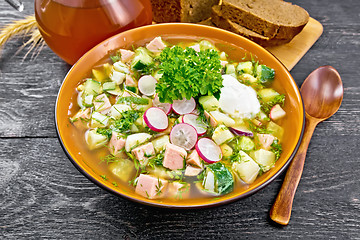 Image showing Okroshka in bowl on black wooden board