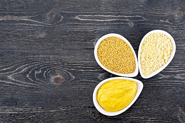 Image showing Mustard different in bowls on board