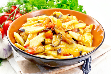 Image showing Pasta penne with eggplant and tomatoes on table