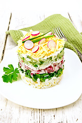 Image showing Salad layered with radish and cucumber on light board