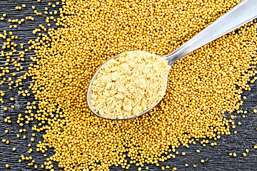 Image showing Mustard powder in spoon on board top