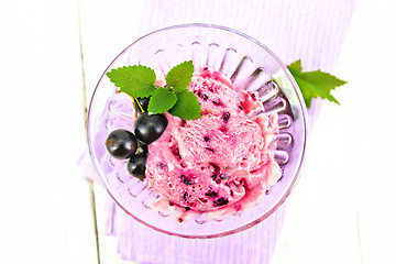 Image showing Ice cream with black currant on board top