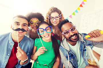 Image showing happy friends or team having fun at office party