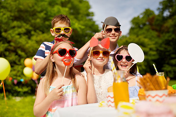 Image showing happy kids with party props on birthday in summer