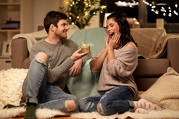 Image showing happy couple with gift box at home
