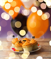 Image showing halloween party decorated cupcakes on plate