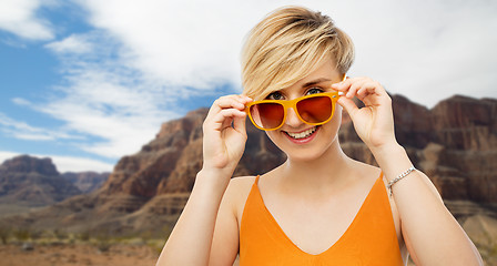 Image showing portrait of smiling young woman in sunglasses