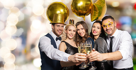 Image showing happy friends clinking champagne glasses at party