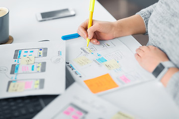 Image showing web designer working on user interface at office