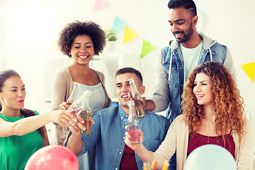 Image showing happy team with drinks celebrating at office party