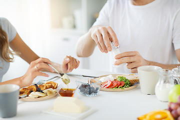 Image showing close up of couple having breakfast at home