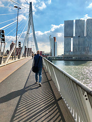 Image showing Tourist on Erasmus bridge crossing river