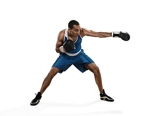 Image showing Sporty man during boxing exercise making hit. Photo of boxer on white background