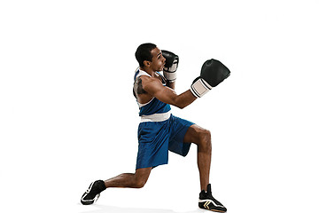 Image showing Sporty man during boxing exercise making hit. Photo of boxer on white background