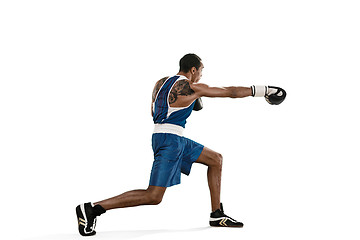 Image showing Sporty man during boxing exercise making hit. Photo of boxer on white background