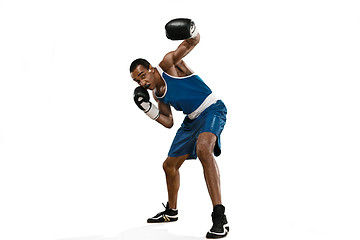 Image showing Sporty man during boxing exercise making hit. Photo of boxer on white background