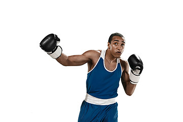 Image showing Sporty man during boxing exercise making hit. Photo of boxer on white background