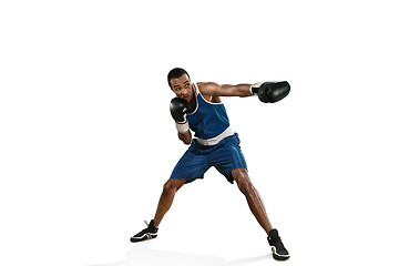 Image showing Sporty man during boxing exercise making hit. Photo of boxer on white background
