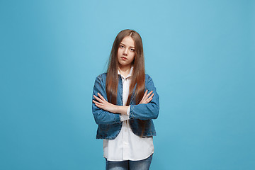 Image showing Young serious thoughtful teen girl. Doubt concept.