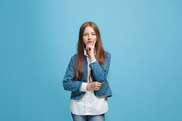 Image showing Young serious thoughtful teen girl. Doubt concept.