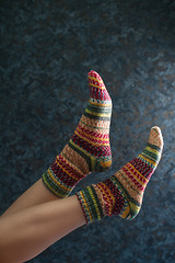 Image showing Woman legs in wool knitted socks