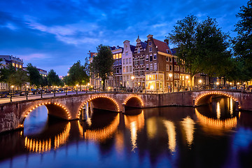 Image showing Amterdam canal, bridge and medieval houses in the evening