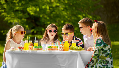 Image showing happy kids on birthday party at summer garden