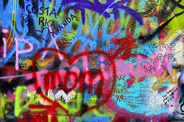 Image showing Detail of bright colorful John Lennon's wall with graffiti in Pr