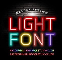 Image showing Light neon fonts on brick wall background. Vector