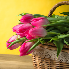 Image showing Beautiful bouquet of pink tulips in a wicker basket