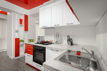 Image showing Modern red and white kitchen interior