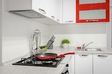 Image showing Modern red and white kitchen interior