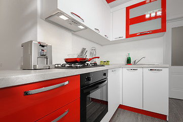 Image showing Modern red and white kitchen interior