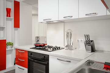 Image showing Modern red and white kitchen interior