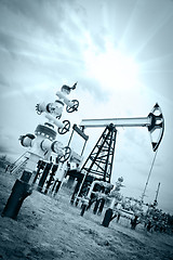 Image showing Pump jack and oilwell.