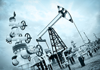 Image showing Pump jack and oilwell.