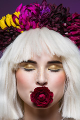 Image showing Beautiful girl with rose in mouth
