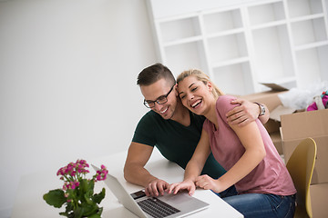 Image showing Young couple moving in a new home